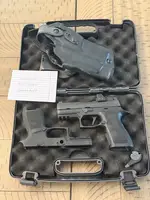 Sig P320 Compact off-roster w/ full-size and compact grips, optic, and holster.